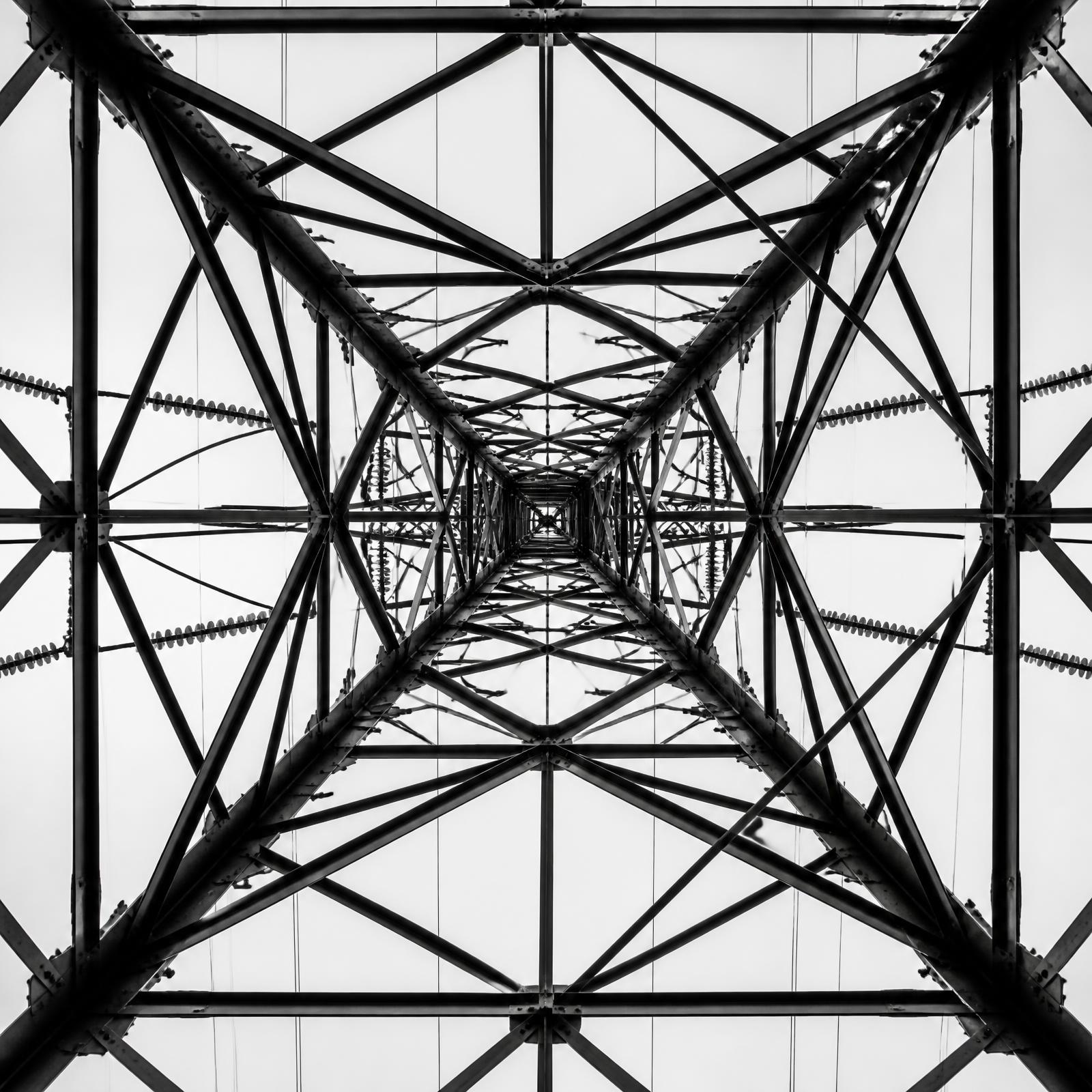 Steel lattice transmission tower photographed from below
